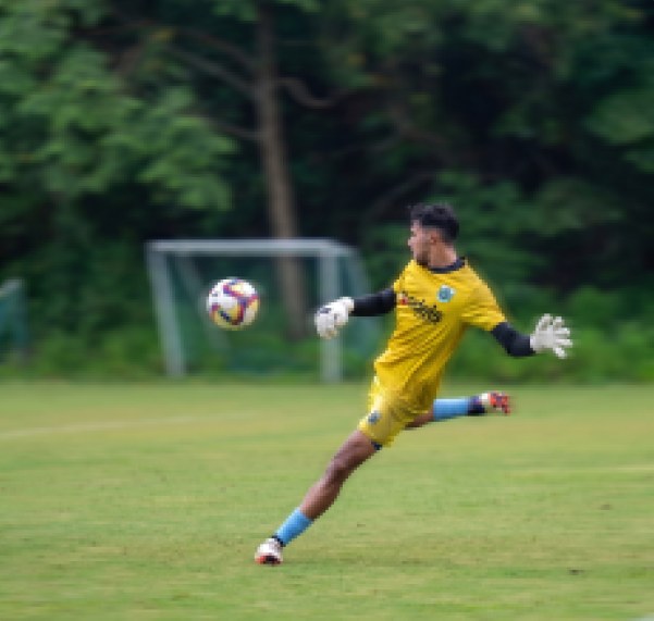 Goalkeeper kicking the ball in training